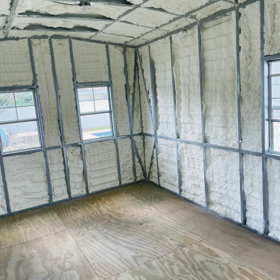 Closed-cell spray foam insulation applied to wall cavities in a residential project in Sultan